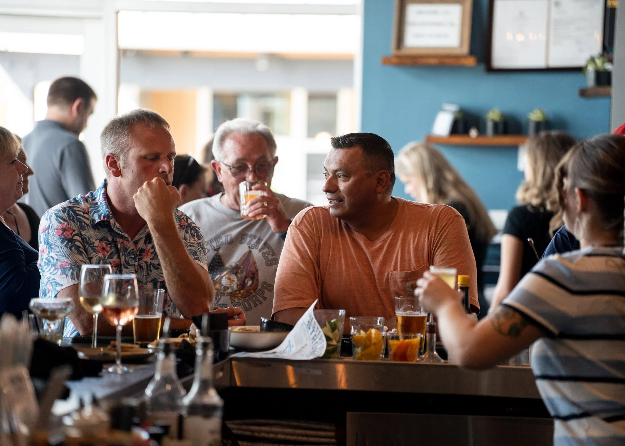 Guests talking together in the Charred dining room