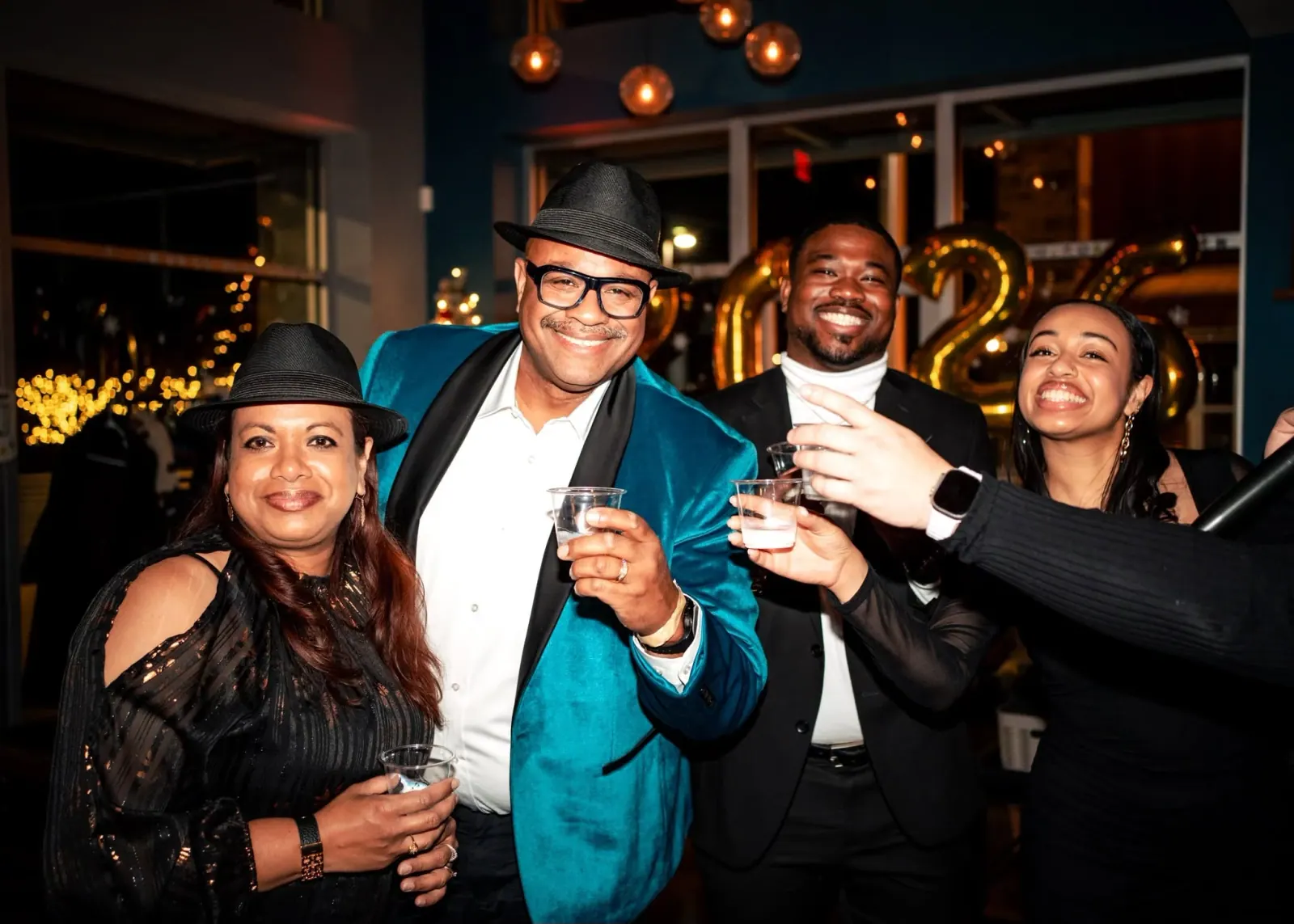 Guests raising glasses during a private celebration at Charred